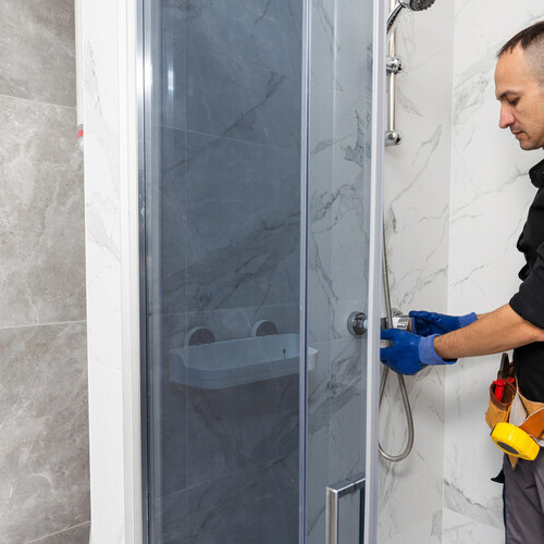 a plumber installing a shower