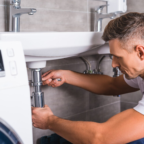 a plumber installing a sink