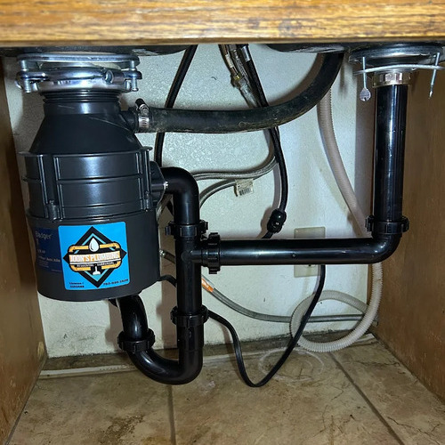 garbage disposal with the company logo