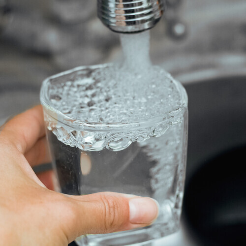 water pouring into a glass